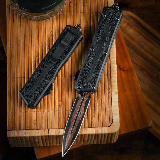 Picture of MICROTECH SCARAB II MARFIONE SELECT D/E BAKER FORGE COPPERMAI DAMASCUS, BLACK AIRCRAFT ALLOY W/ STINGRAY INLAY, 1280-16MS1